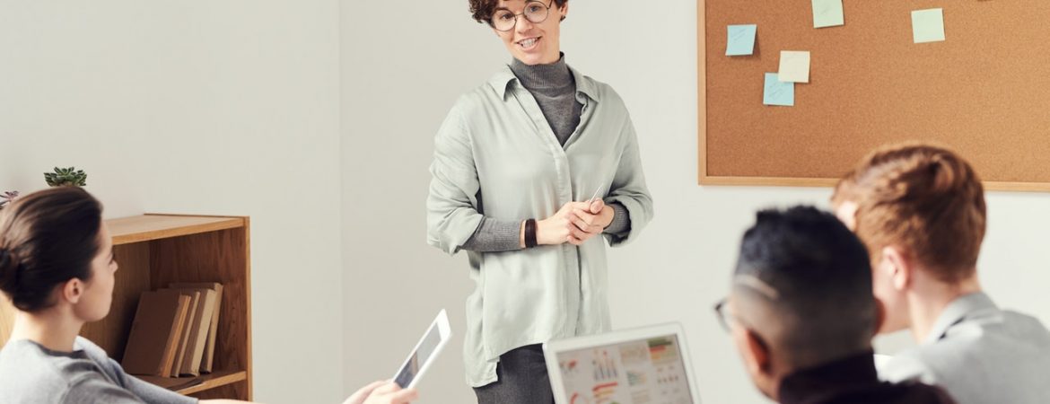 woman-wearing-gray-cardigan-and-eyeglasses-3184295